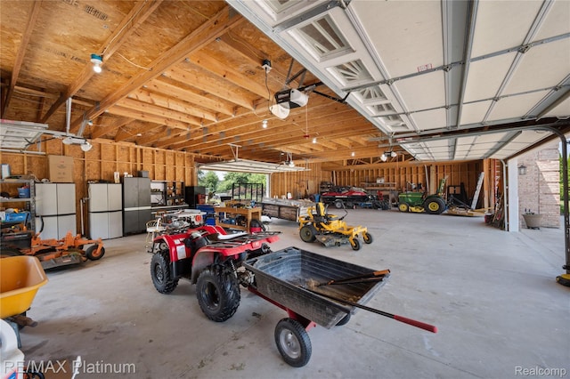 8922 Mcclements Rd, Brighton, MI 48114 - garage featuring a garage door opener