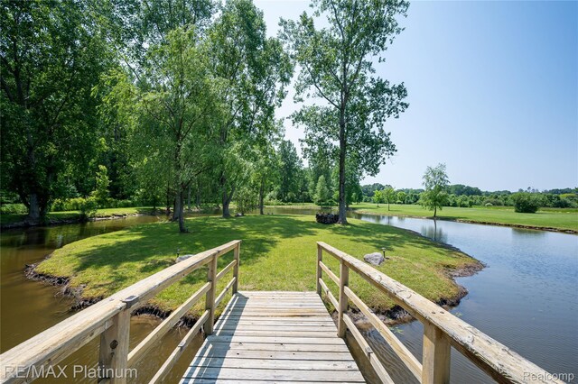 8922 Mcclements Rd, Brighton, MI 48114 - dock with a water view and a yard