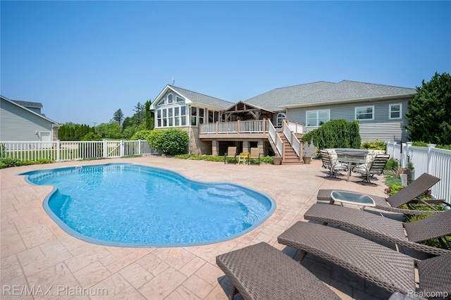 8922 Mcclements Rd, Brighton, MI 48114 - view of pool featuring stairs, a fenced backyard, a patio area, a wooden deck, and outdoor dining area