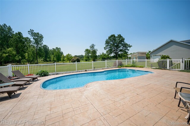 8922 Mcclements Rd, Brighton, MI 48114 - view of swimming pool featuring a patio area