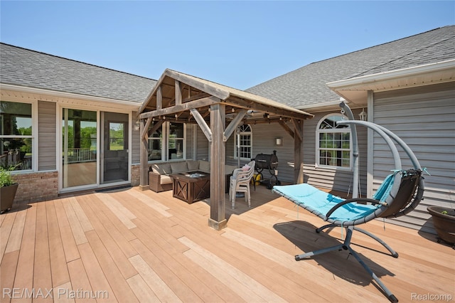 8922 Mcclements Rd, Brighton, MI 48114 - wooden deck featuring an outdoor living space with a fire pit and a gazebo