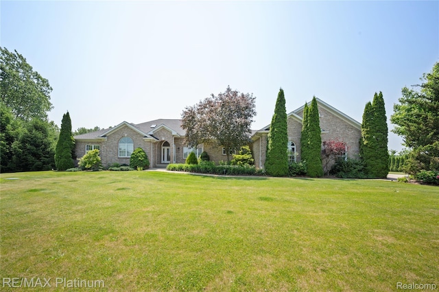 8922 Mcclements Rd, Brighton, MI 48114 - view of front of property featuring a front lawn and stone siding