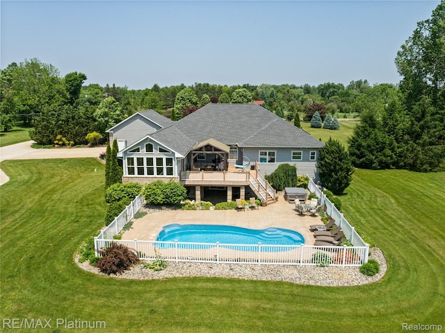 8922 Mcclements Rd, Brighton, MI 48114 - back of property featuring stairway, a fenced backyard, a deck, and a shingled roof