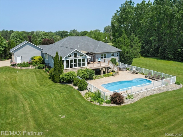 8922 Mcclements Rd, Brighton, MI 48114 - back of property with a fenced backyard and a wooden deck