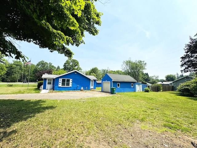 1225 Huntly Rd, Niles, MI 49120 - rear view of house with an outdoor structure, driveway, and a garage