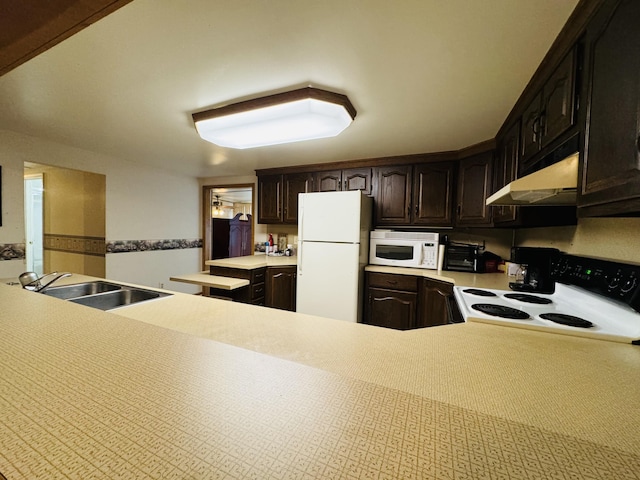 1225 Huntly Rd, Niles, MI 49120 - kitchen featuring white appliances, under cabinet range hood, light countertops, and dark brown cabinetry