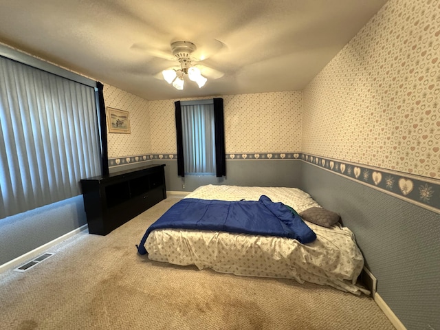 1225 Huntly Rd, Niles, MI 49120 - carpeted bedroom with wallpapered walls and ceiling fan