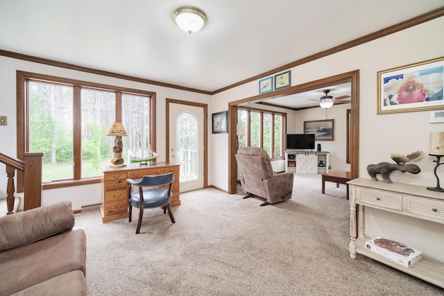 3750 River Rd, Manistee, MI 49660 - living room with light carpet, a ceiling fan, and ornamental molding