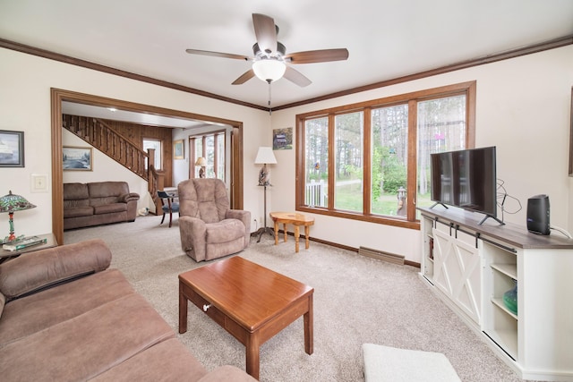 3750 River Rd, Manistee, MI 49660 - living room featuring light carpet, a ceiling fan, stairway, and crown molding