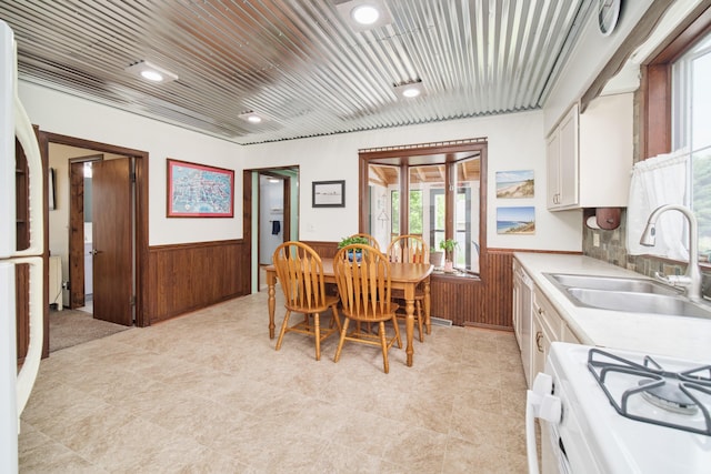 3750 River Rd, Manistee, MI 49660 - dining room with a wainscoted wall and wood walls