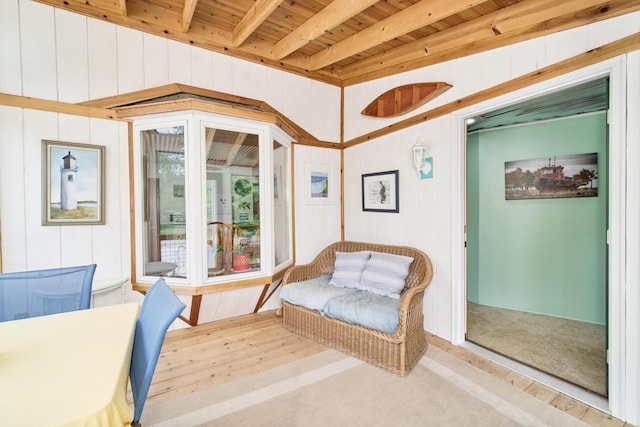 3750 River Rd, Manistee, MI 49660 - living area with wood finished floors and a wood ceiling with exposed beams