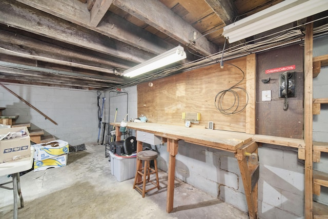 3750 River Rd, Manistee, MI 49660 - unfinished basement with a workshop area and stairs