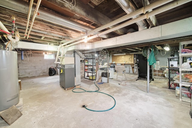 3750 River Rd, Manistee, MI 49660 - unfinished below grade area with water heater and heating unit