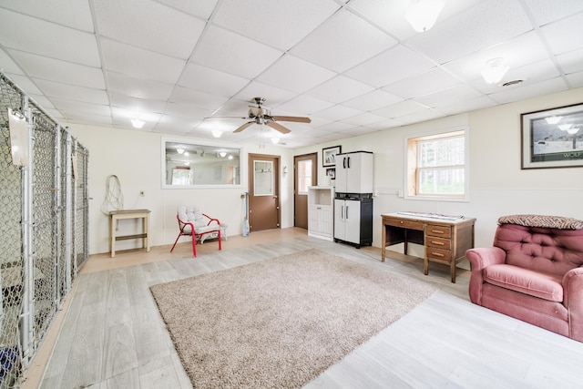 3750 River Rd, Manistee, MI 49660 - living room with a drop ceiling, light wood finished floors, and a ceiling fan