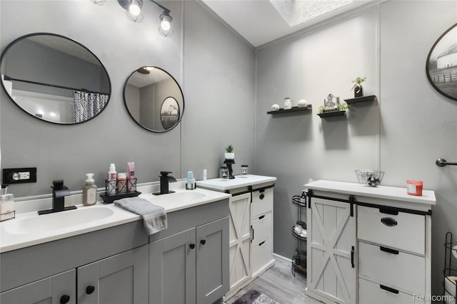 13482 Pear St, Carleton, MI 48117 - full bathroom with two vanities and wood finished floors