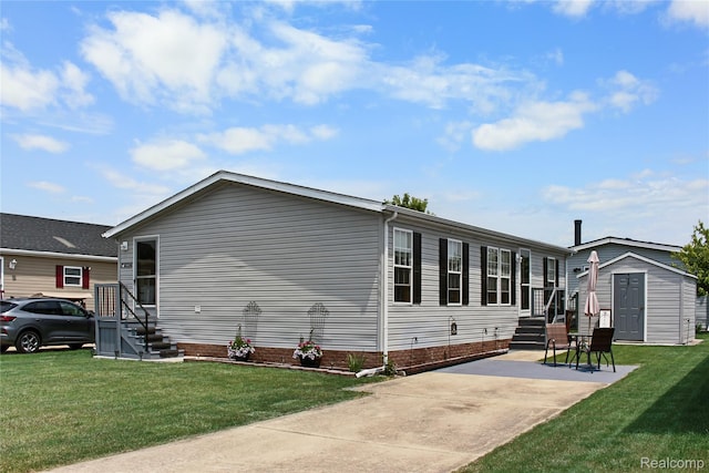 13482 Pear St, Carleton, MI 48117 - rear view of property featuring a lawn and a storage unit