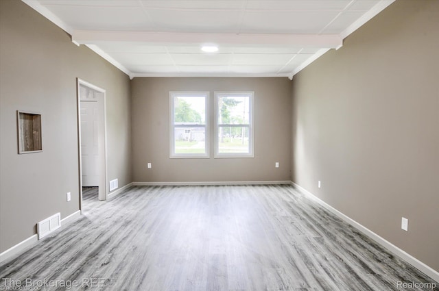 1372 S Packard Ave, Burton, MI 48509 - spare room featuring light wood-style flooring and baseboards