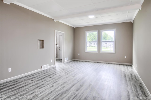 1372 S Packard Ave, Burton, MI 48509 - spare room featuring light wood-type flooring and crown molding