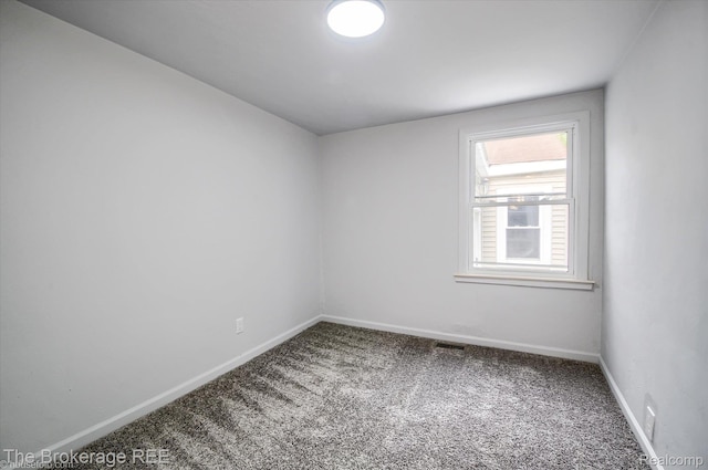 1372 S Packard Ave, Burton, MI 48509 - carpeted empty room featuring baseboards