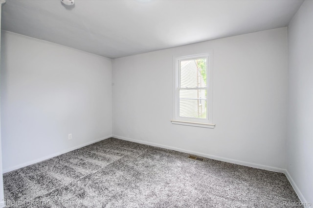 1372 S Packard Ave, Burton, MI 48509 - empty room with carpet floors and baseboards