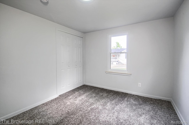 1372 S Packard Ave, Burton, MI 48509 - unfurnished bedroom with carpet and a closet