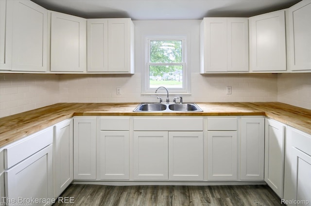 1372 S Packard Ave, Burton, MI 48509 - kitchen with wooden counters, decorative backsplash, and white cabinetry