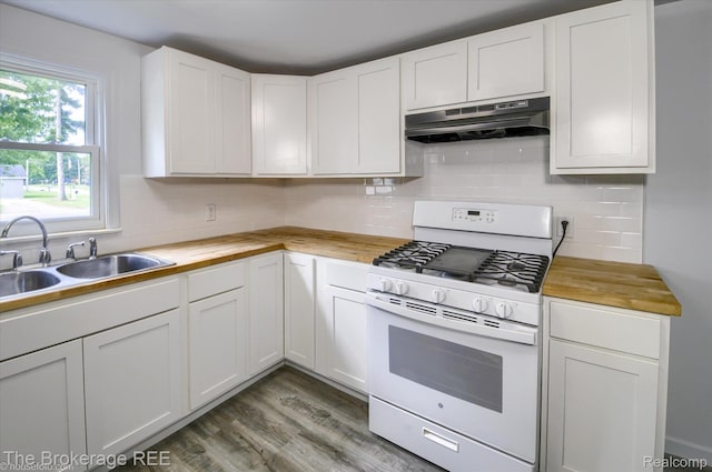 1372 S Packard Ave, Burton, MI 48509 - kitchen featuring white range with gas cooktop, under cabinet range hood, butcher block counters, and decorative backsplash