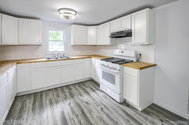 1372 S Packard Ave, Burton, MI 48509 - kitchen with white gas range oven, wooden counters, under cabinet range hood, light wood-type flooring, and white cabinetry