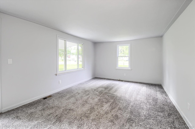 1372 S Packard Ave, Burton, MI 48509 - carpeted empty room featuring baseboards