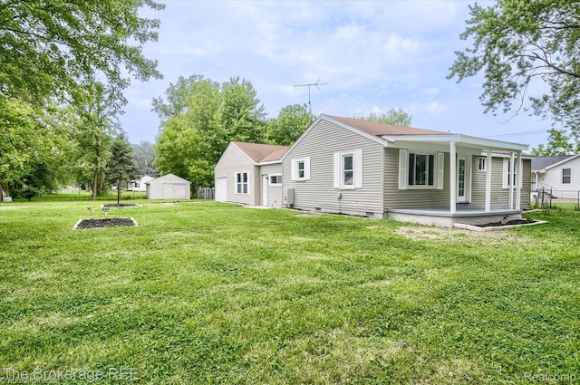 1372 S Packard Ave, Burton, MI 48509 - back of property with a yard and a storage unit
