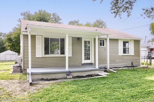 1372 S Packard Ave, Burton, MI 48509 - view of front facade with a porch and a shingled roof