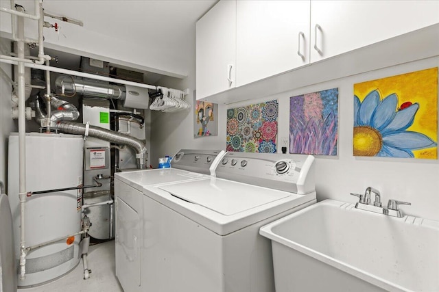 21112 Boulder Cir, Northville, MI 48167 - laundry room featuring washer and dryer, cabinet space, and gas water heater