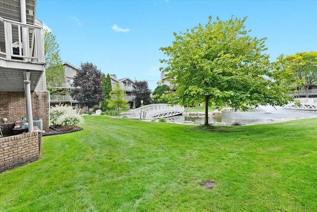 21112 Boulder Cir, Northville, MI 48167 - view of grassy yard featuring a water view