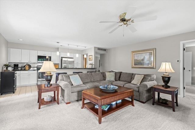 21112 Boulder Cir, Northville, MI 48167 - living room featuring light carpet and ceiling fan