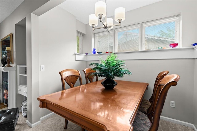 21112 Boulder Cir, Northville, MI 48167 - carpeted dining space with a chandelier, plenty of natural light, and a warm lit fireplace