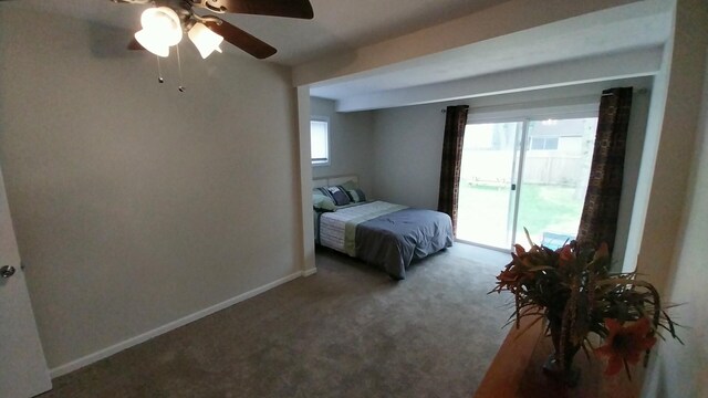 1418 Stamford Ave, Kalamazoo, MI 49048 - carpeted bedroom with multiple windows and a ceiling fan
