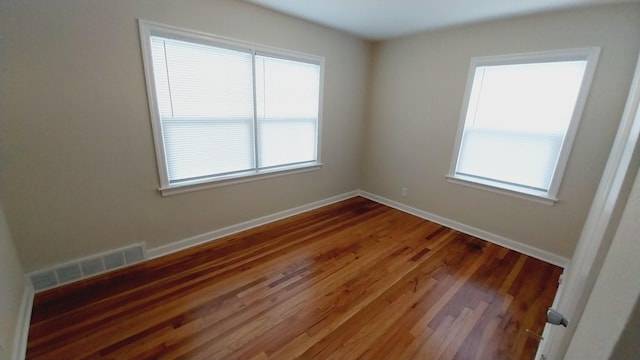 1418 Stamford Ave, Kalamazoo, MI 49048 - unfurnished room featuring wood finished floors and baseboards