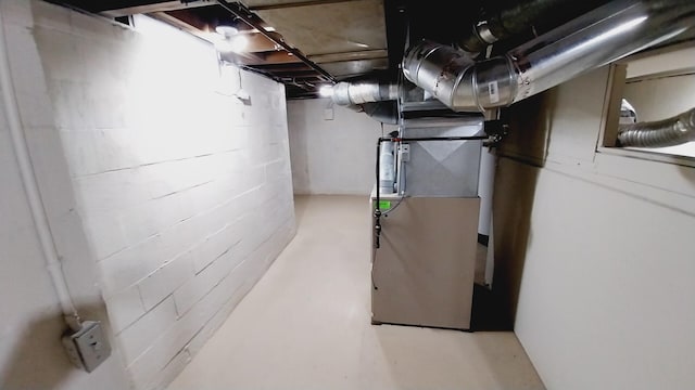1418 Stamford Ave, Kalamazoo, MI 49048 - unfinished basement featuring concrete block wall and heating unit