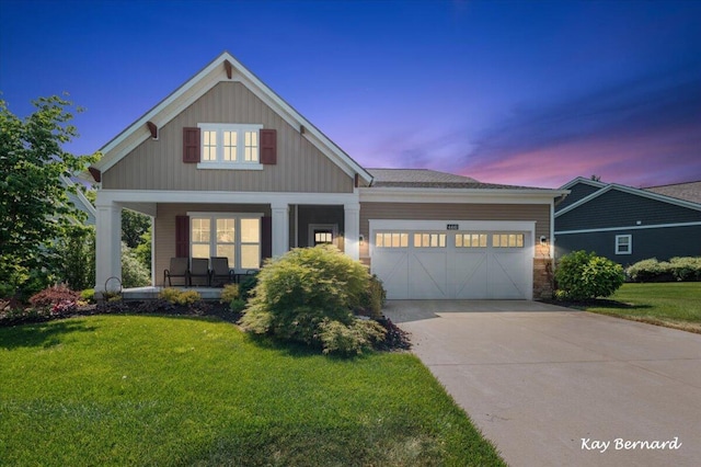 4441 Koinonia Dr NE Unit 3, Grand Rapids, MI 49525 - craftsman inspired home with a porch, an attached garage, a front lawn, concrete driveway, and board and batten siding