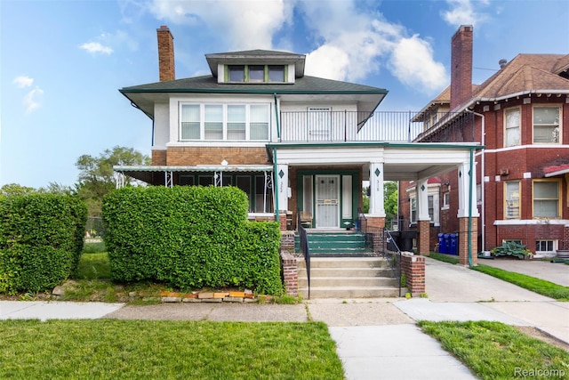 318 Chandler St, Detroit, MI 48202 - american foursquare style home featuring covered porch, a balcony, brick siding, and a chimney