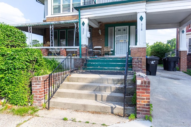 318 Chandler St, Detroit, MI 48202 - property entrance with brick siding and a porch