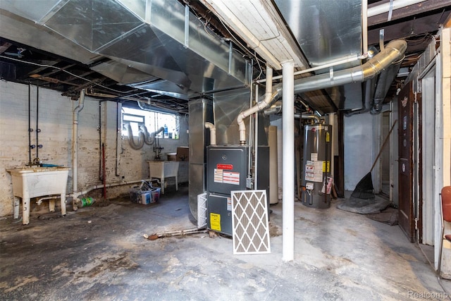 318 Chandler St, Detroit, MI 48202 - below grade area featuring gas water heater and heating unit