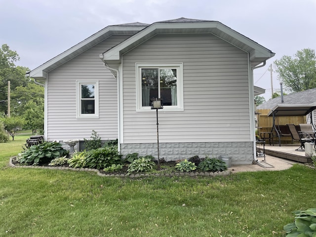 108 S Berrien St, New Buffalo, MI 49117 - view of property exterior featuring a lawn and a patio