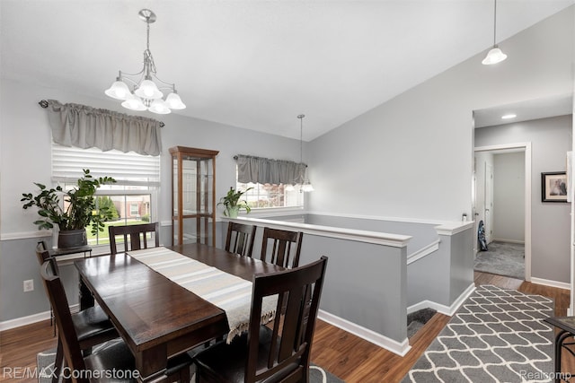 1232 Michael Dr, Westland, MI 48186 - dining space with a chandelier, wood finished floors, and lofted ceiling