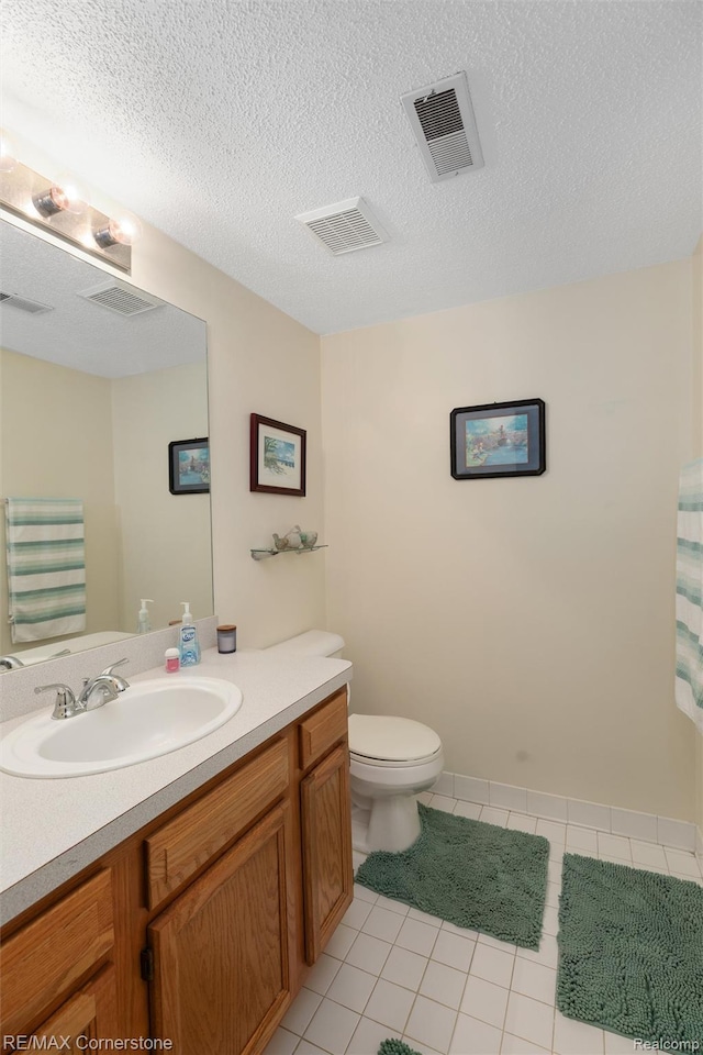 1232 Michael Dr, Westland, MI 48186 - bathroom featuring vanity, tile patterned floors, and a textured ceiling