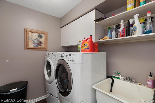 1232 Michael Dr, Westland, MI 48186 - washroom featuring cabinet space, separate washer and dryer, and a textured ceiling