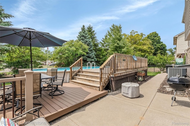 1232 Michael Dr, Westland, MI 48186 - deck with an outdoor pool, outdoor dining space, and a patio area