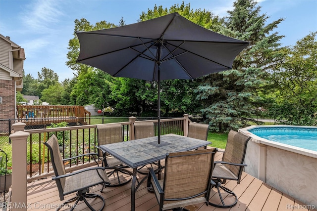 1232 Michael Dr, Westland, MI 48186 - deck with outdoor dining space and an outdoor pool