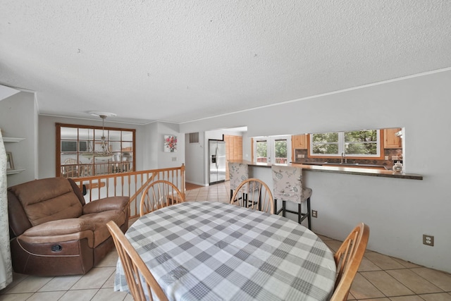4787 Hooks Mill Rd, Adrian, MI 49221 - dining area with light tile patterned floors and a textured ceiling