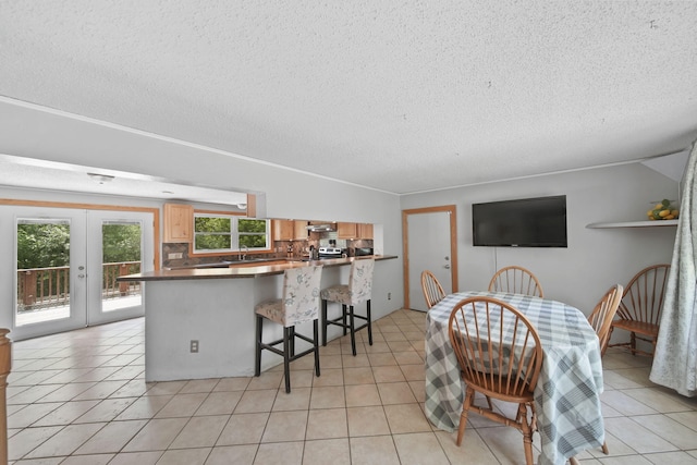 4787 Hooks Mill Rd, Adrian, MI 49221 - dining area featuring a textured ceiling, plenty of natural light, light tile patterned floors, and french doors